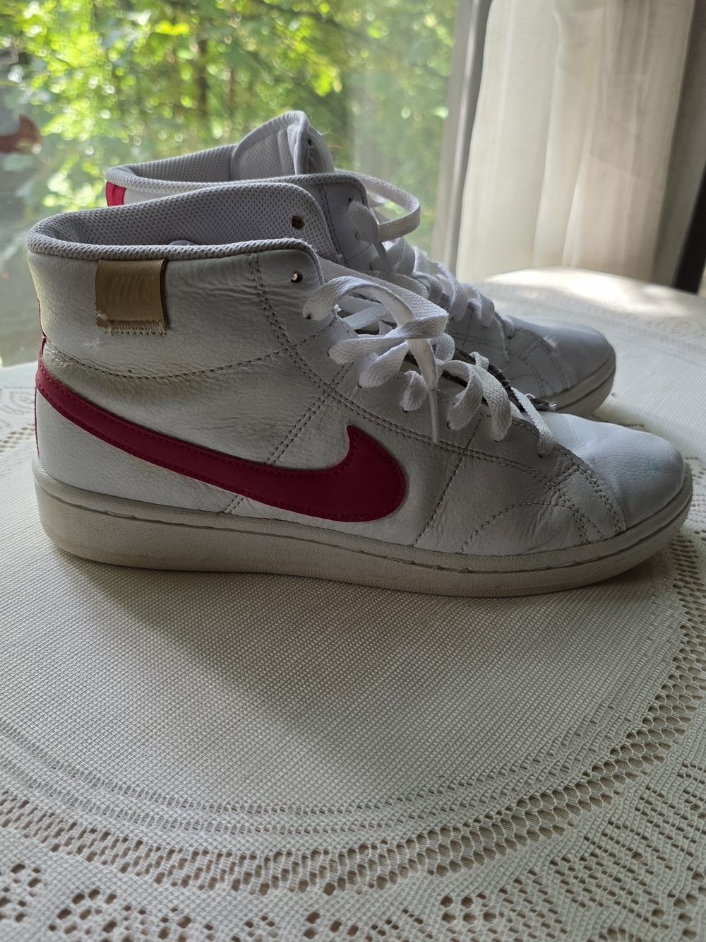 Nike White High-Top Sneakers with Pink Swoosh